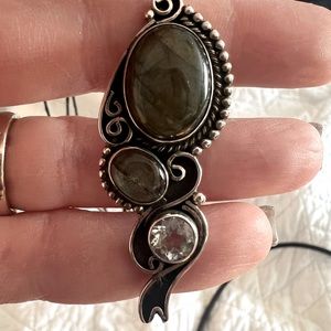 A beautiful sterling silver pendant on a leather necklace with jewelry box